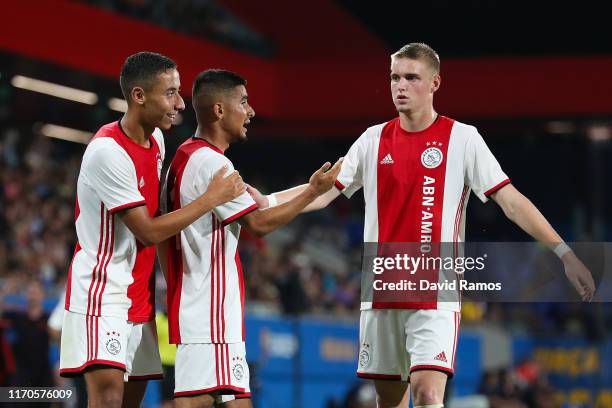 Naci Unuvar of Ajax U19 celebrates with his team mates Devyne Rensch and Kenneth Taylor after scoring his team's second goal past Ramon of FC...