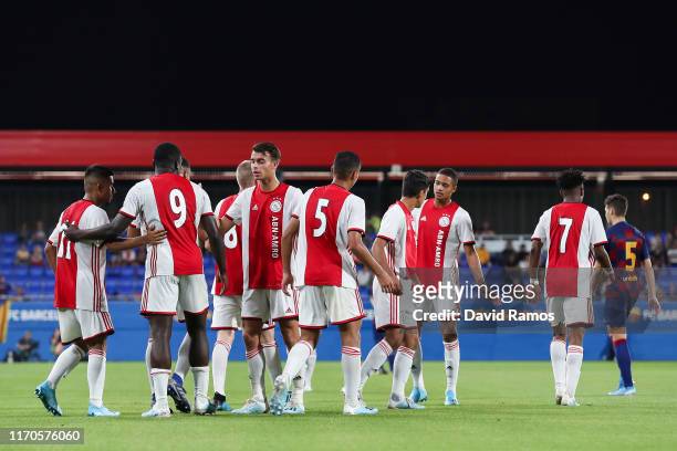 Naci Unuvar of Ajax U19 celebrates with his team mates after scoring his team's second goal past Ramon of FC Barcelona during their friendly match...