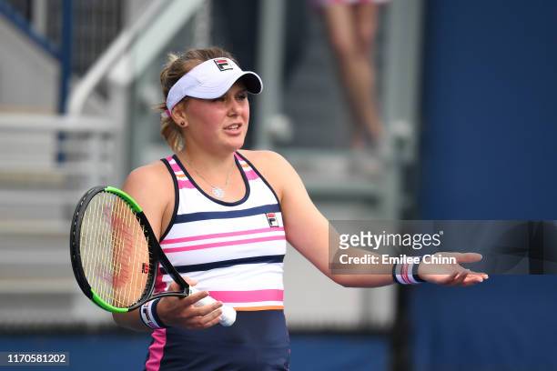 Kateryna Kozlova of the of the Ukraine reacts against Taylor Townsend of the United States during their Women's Singles first round match on day two...