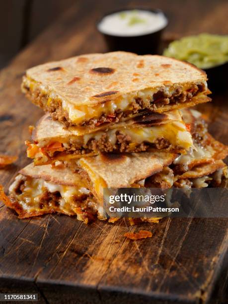 cheesy beef taco quesadilla - quesadilla stock pictures, royalty-free photos & images