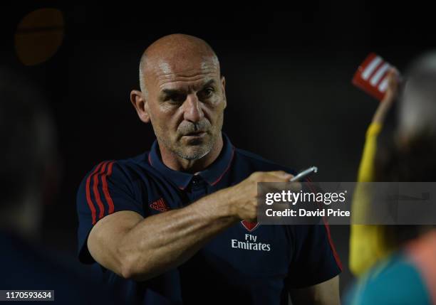 Arsenal U21 Manager Steve Bould talks to his players before the penalty shoot out after the Leasing.com match between Northampton Town and Arsenal...