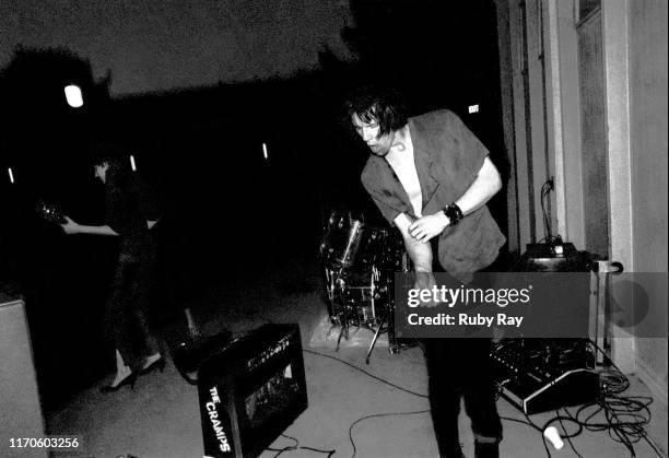 American singer Lux Interior of American punk band The Cramps at an outdoor show on the Rec Hall steps at Napa State Hospital, a psychiatric hospital...