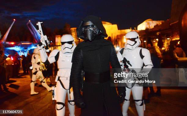 Characters Kylo Ren and Storm Troopers walk during night at the Star Wars: Galaxy's Edge Walt Disney World Resort Opening at Disney’s Hollywood...