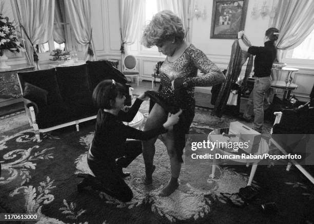 Tina Turner during a fashion fitting in her suite at Le Crillon Hotel in Paris, France, 11th February 1996. This image is one of a series by British...