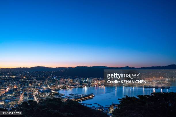 new zealand wellington sunset cityscape at night - wellington harbour stock pictures, royalty-free photos & images