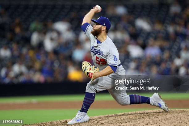 Russell Martin of the Los Angeles Dodgers pitches during the ninth inning of a game against the San Diego Padresat PETCO Park on August 27, 2019 in...