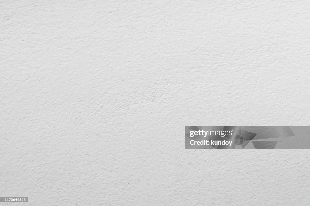 Abstract background from white concrete texture on wall.