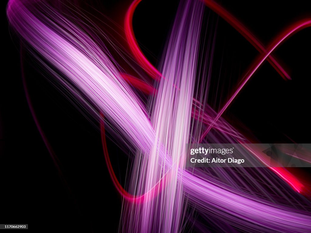 Futuristic purple and red lines. Image that transmits energy and vitality. Light painting