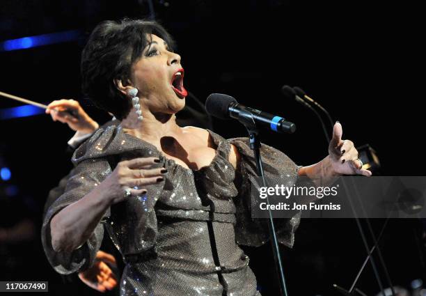 Singer Dame Shirley Bassey performs on stage during the John Barry Memorial Concert at the Royal Albert Hall on June 20, 2011 in London, England.