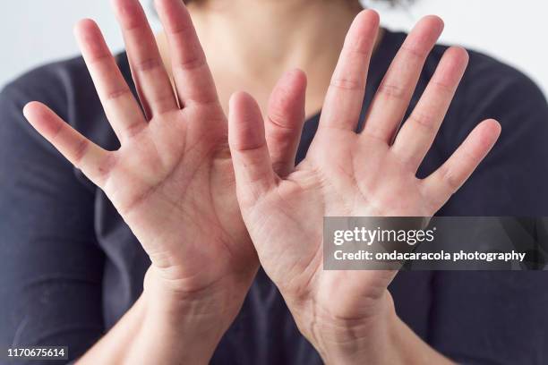 self defense gesturing - bullying stock pictures, royalty-free photos & images