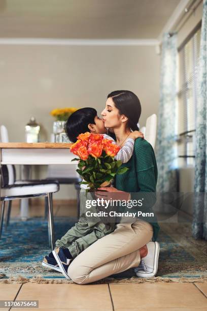 mom is the queen in his life - indian mother and child stock pictures, royalty-free photos & images