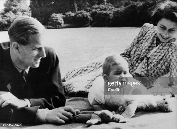 Picture taken on July 20, 1949 at Windlesham Moor showing Princess Elizabeth of England and her husband Prince Philip, Duke of Edinburgh with their...