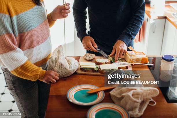 lunchtime at home - making a sandwich stockfoto's en -beelden