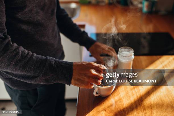 time for a cuppa - making stock pictures, royalty-free photos & images