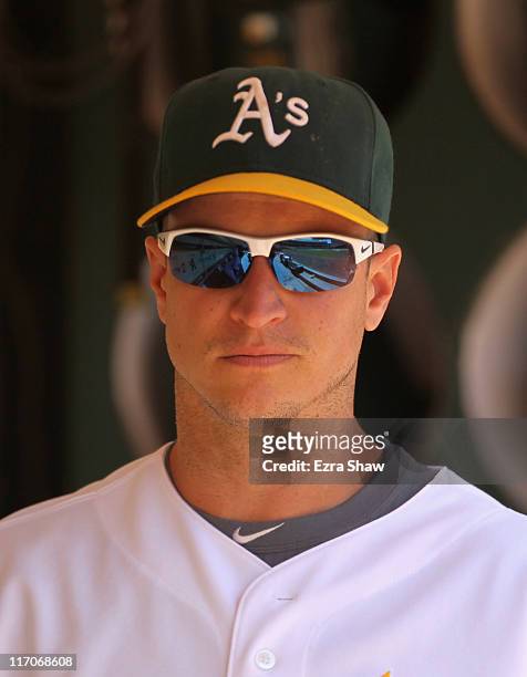 Mark Ellis of the Oakland Athletics stands in the dugout before their game against the Baltimore Orioles at Oakland-Alameda County Coliseum on May...