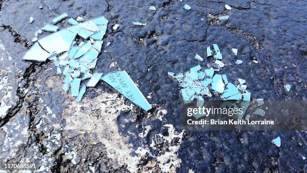 shattered glass in parking lot - broken glass pieces stock pictures, royalty-free photos & images