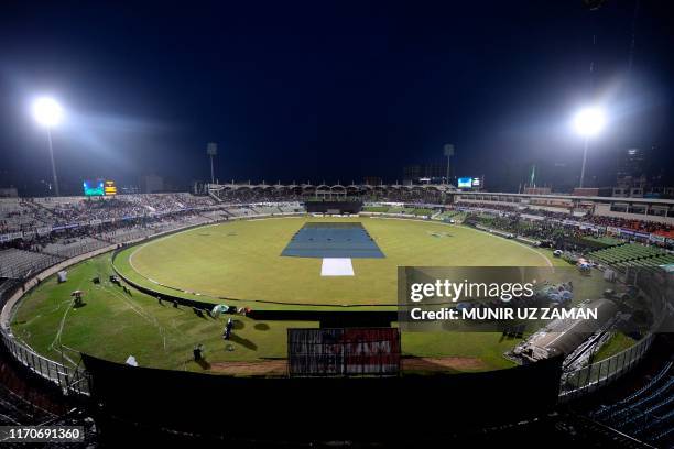 General view of the field is pictured as rain comes and delays the match during the third and final Twenty20 international match of a tri-nation...