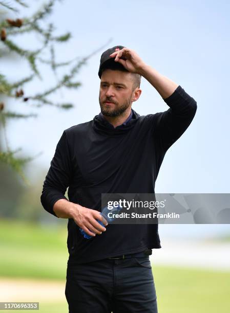 Singer Justin Timberlake of USA ponders a shot during the pro-am prior to the start of the Omega European Masters at Crans Montana Golf Club on...