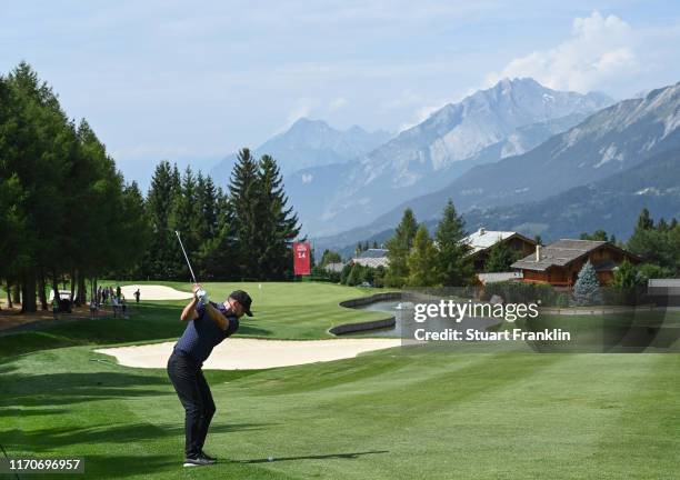 Singer Justin Timberlake of USA plays a shot during the pro-am prior to the start of the Omega European Masters at Crans Montana Golf Club on August...