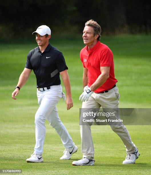 Actor Dennis Quaid walks with Rory McIlroy of Northern Ireland during the pro-am prior to the start of the Omega European Masters at Crans Montana...