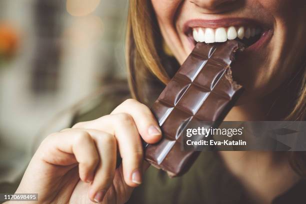 eating chocolate - dark chocolate stock pictures, royalty-free photos & images