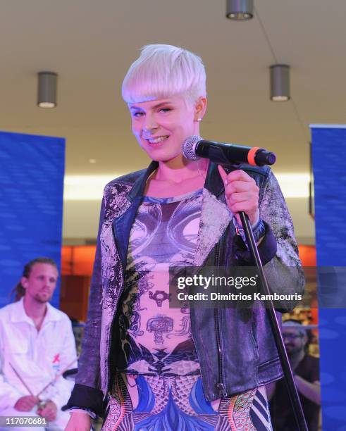 Singer Robyn performs during JetBlue's Live From T5 concert series at Terminal 5 at JFK Airport on June 20, 2011 in New York City.