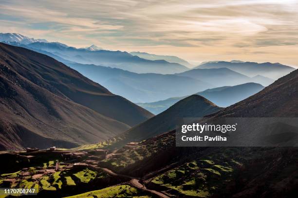 the high atlas, valleys, hills mist, morocco,north africa - atlas mountains morocco stock pictures, royalty-free photos & images