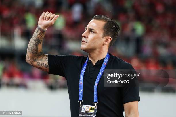 Guangzhou Evergrande head coach Fabio Cannavaro reacts during the AFC Champions League quarter-final 1st leg match between Guangzhou Evergrande and...