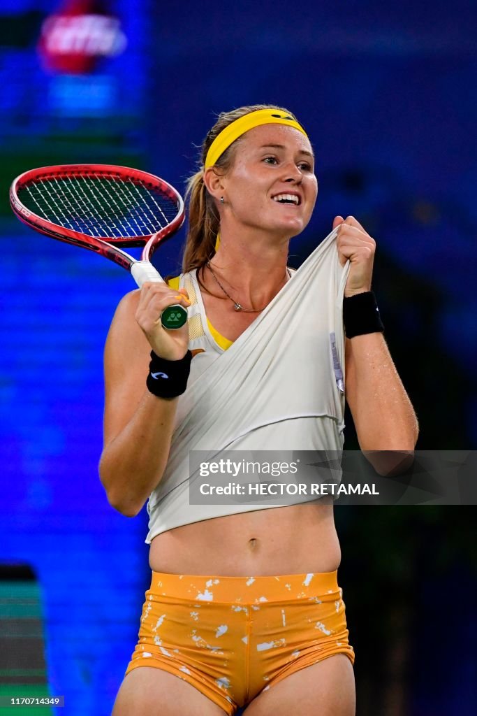 Marie Bouzkova of Czech Republic gestures while playing against Wang