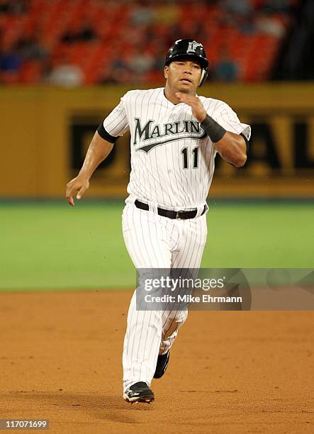 Jose Lopez of the Florida Marlins rounds second during a game against the Los Angeles Angels of Anaheim at Sun Life Stadium on June 20, 2011 in Miami...