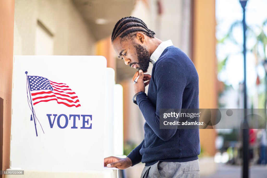 Millenial Black Man Voting in Election