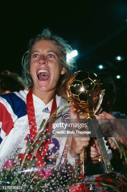 Carin Jennings raises the trophy in the air in celebration after the United States team beat Norway 2-1 in the final of the 1991 FIFA Women's World...
