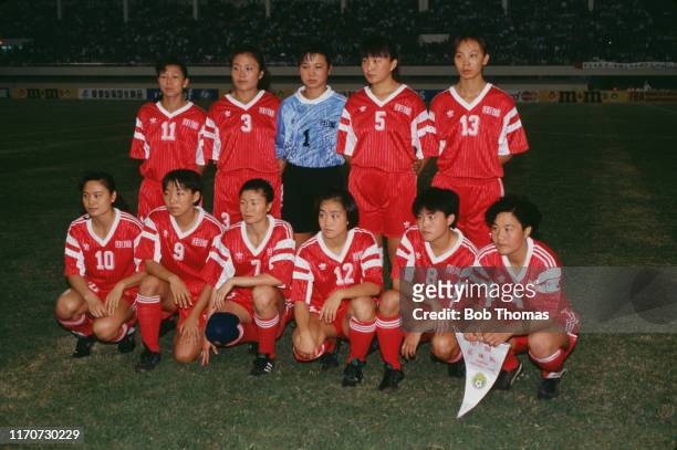 Members of the China football squad posed together prior to playing in a group A match during the 1991 FIFA Women's World Cup tournament in China in...