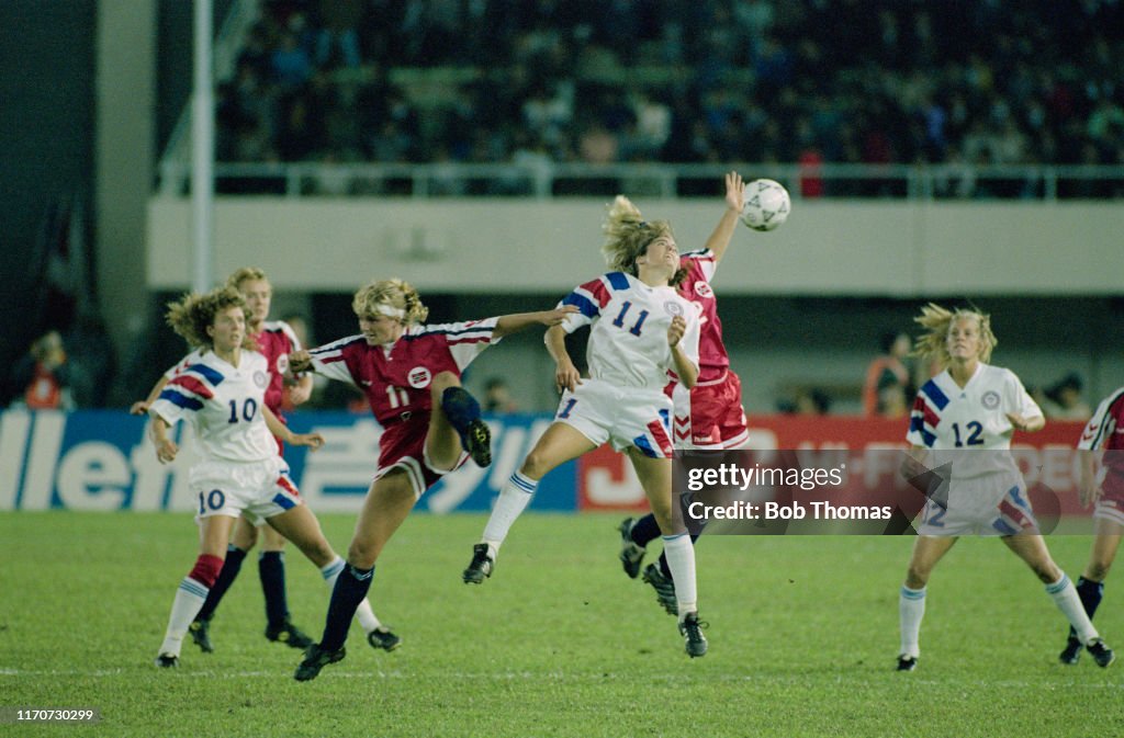 Team Mates Michelle Akers And Carin Jennings Look On As Julie Foudy team-mates-michelle-akers-and-carin-jennings-look-on-as-julie-foudy