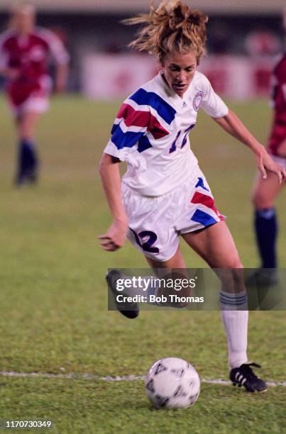Carin Jennings of the United States makes a run with the ball during play in the final of the 1991 FIFA Women's World Cup between Norway and the...