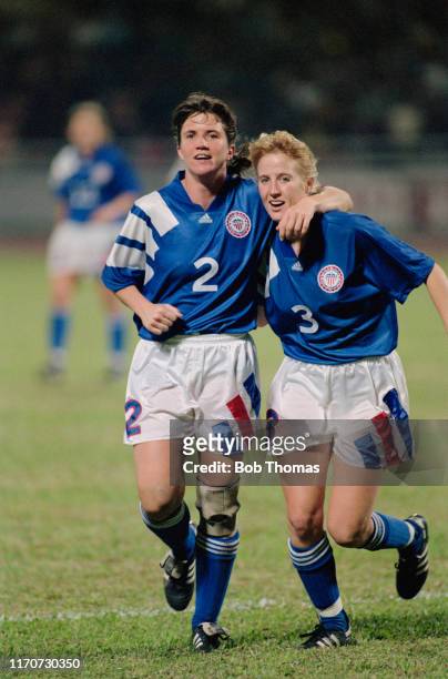 April Heinrichs and Shannon Higgins of the United States team celebrate during play in the 1991 FIFA Women's World Cup semi final match between...