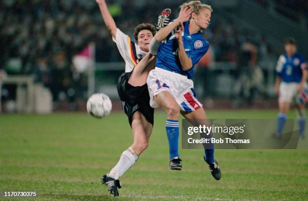 Jutta Nardenbach of Germany and Carin Jennings of the United States clash during play in the 1991 FIFA Women's World Cup semi final match between...