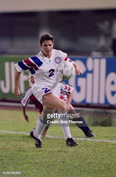 April Heinrichs of the United States makes a run with the ball during play in the 1991 FIFA Women's World Cup final match between Norway and the...