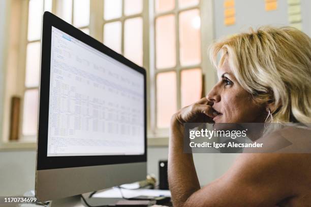 woman working on programming codes - java stock pictures, royalty-free photos & images