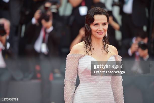 Juliette Binoche walks the red carpet ahead of the Opening Ceremony and the "La Vérité" screening during the 76th Venice Film Festival at Sala Grande...