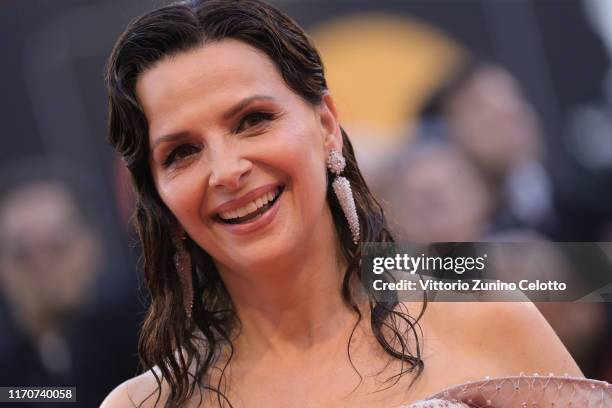 Juliette Binoche walks the red carpet ahead of the Opening Ceremony and the "La Vérité" screening during the 76th Venice Film Festival at Sala Grande...