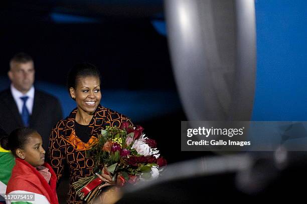 United States First Lady Michelle Obama and her daughter Sasha arrive at the Waterkloof Airport on June 20, 2011 in Pretoria, South Africa. Obama is...