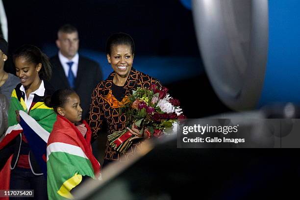 United States First Lady Michelle Obama and her daughters Malia and Sasha arrive at the Waterkloof Airport on June 20, 2011 in Pretoria, South...