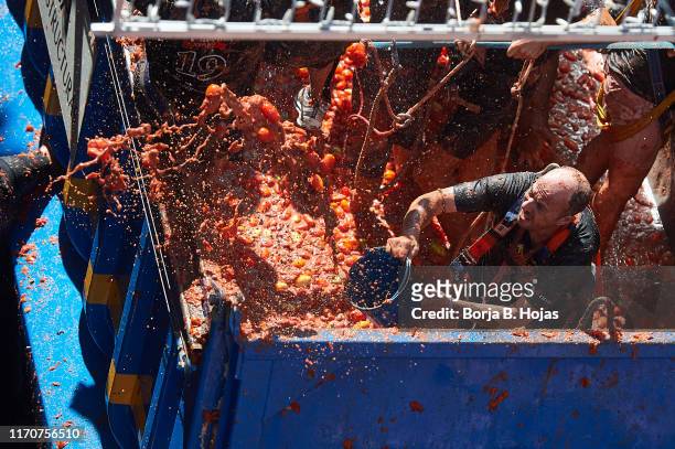 People play around a Tomato Fight during Tomatina Festival on August 28, 2019 in Bunol, Spain. The Tomatina Festival began in 1945 but was forbidden...