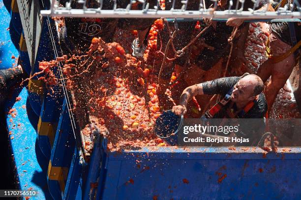 People play around a Tomato Fight during Tomatina Festival on August 28, 2019 in Bunol, Spain. The Tomatina Festival began in 1945 but was forbidden...