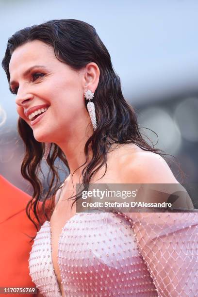 Juliette Binoche walks the red carpet ahead of the Opening Ceremony and the "La Vérité" screening during the 76th Venice Film Festival at Sala Grande...