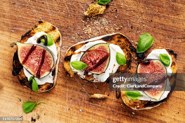 fresh figs with ricotta cheese, fresh basil and balsamic vinegar. - fig stock pictures, royalty-free photos & images