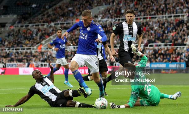 Jamie Vardy of Leicester City challenged by Jetro Willems of Newcastle United during the Carabao Cup Second Round match between Newcastle United and...