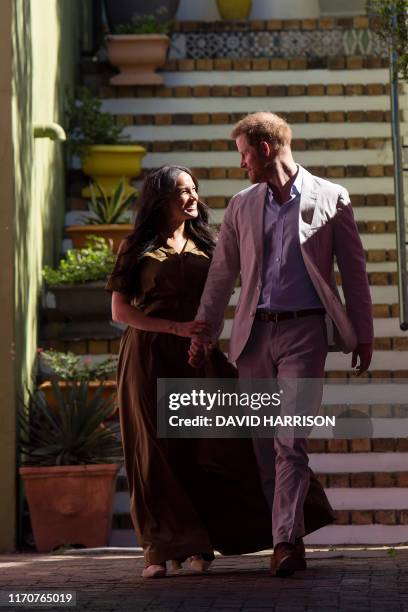 Prince Harry , Duke of Sussex and Meghan Duchess of Sussex arrive to visit the oldest mosque of Cape Town in Dorp Street in Bo Kaap district on...