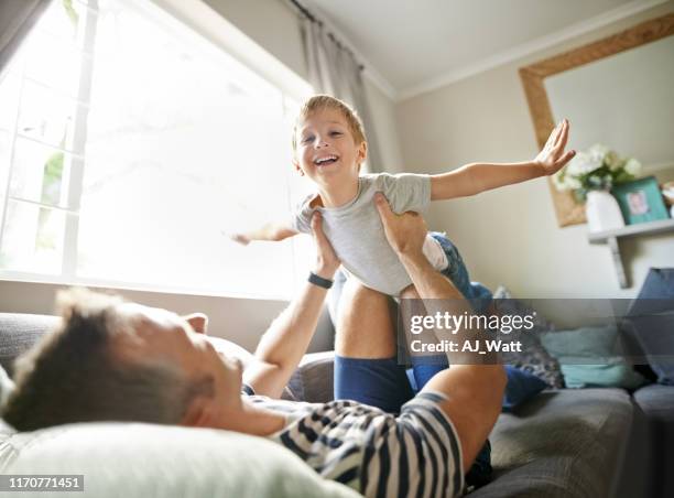 i am flying - flying dad son stock pictures, royalty-free photos & images